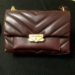 Michael Kors “Whitney” Burgundy medium quilted shoulder/crossbody purse